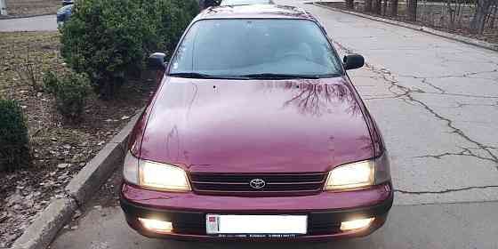 Продам надежный автомобильToyota Carina E, хетчбэк, 1995 года, Bender